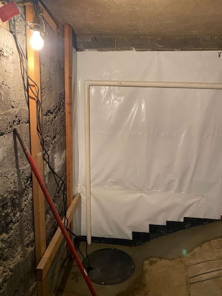 Queen Foundation Repair crew completing an egress window project on a residential home