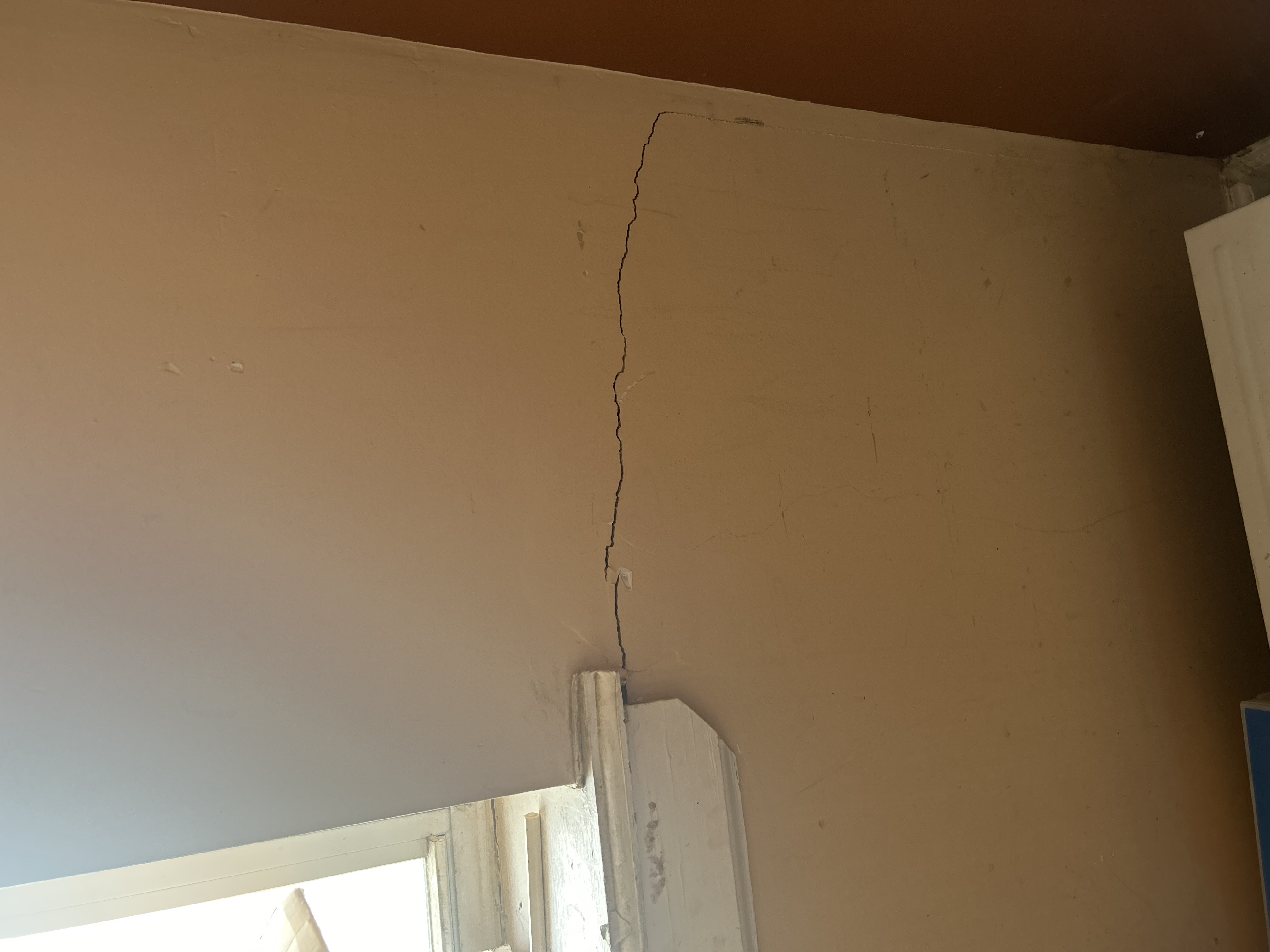 Foundation wall crack that has widened over time showing visible gap