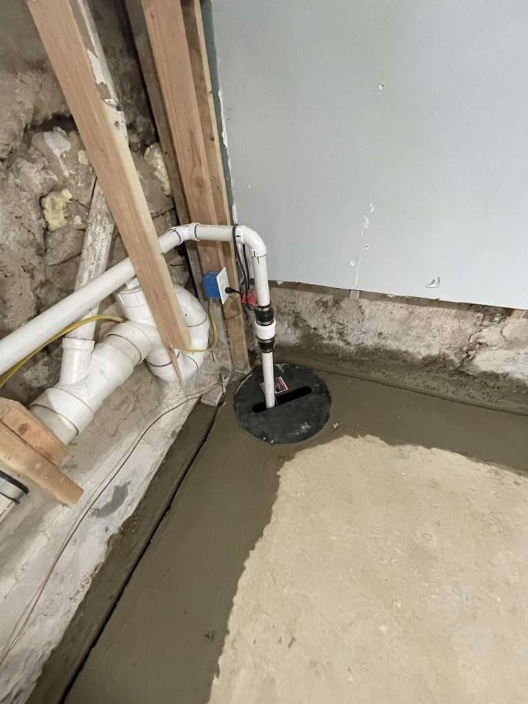 Installed sump pump and drainage system to prevent flooding and moisture buildup