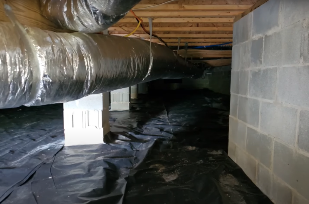Crawl space repair including support jacks and beam replacement